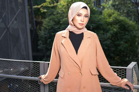 Cyberjaya, Malaysia â 25 December 2019: Fashion portraiture of young beautiful muslim woman wearing hijab.のeditorial素材
