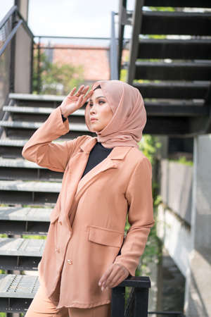 Cyberjaya, Malaysia â 25 December 2019: Fashion portraiture of young beautiful muslim woman wearing hijab.のeditorial素材