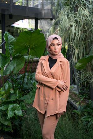 Cyberjaya, Malaysia â 25 December 2019: Fashion portraiture of young beautiful muslim woman wearing hijab.のeditorial素材