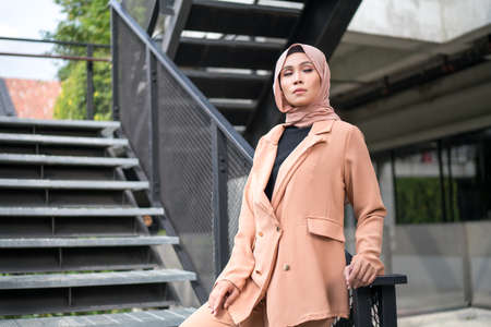 Cyberjaya, Malaysia â 25 December 2019: Fashion portraiture of young beautiful muslim woman wearing hijab.のeditorial素材