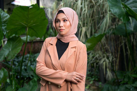 Cyberjaya, Malaysia â 25 December 2019: Fashion portraiture of young beautiful muslim woman wearing hijab.のeditorial素材