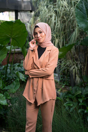 Cyberjaya, Malaysia â 25 December 2019: Fashion portraiture of young beautiful muslim woman wearing hijab.のeditorial素材