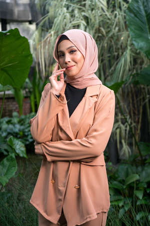 Cyberjaya, Malaysia â 25 December 2019: Fashion portraiture of young beautiful muslim woman wearing hijab.のeditorial素材