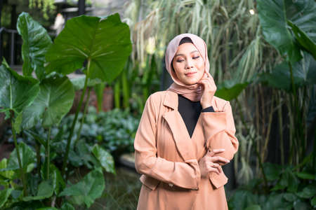 Cyberjaya, Malaysia â€“ 25 December 2019: Fashion portraiture of young beautiful muslim woman...
