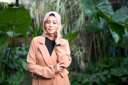 Cyberjaya, Malaysia â 25 December 2019: Fashion portraiture of young beautiful muslim woman wearing hijab.のeditorial素材