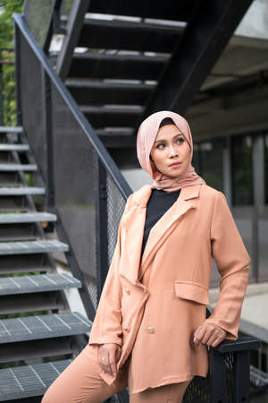 Cyberjaya, Malaysia â 25 December 2019: Fashion portraiture of young beautiful muslim woman wearing hijab.のeditorial素材