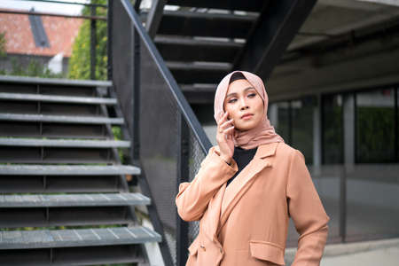 Cyberjaya, Malaysia â 25 December 2019: Fashion portraiture of young beautiful muslim woman wearing hijab.のeditorial素材