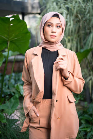 Cyberjaya, Malaysia â 25 December 2019: Fashion portraiture of young beautiful muslim woman wearing hijab.のeditorial素材