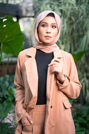 Cyberjaya, Malaysia â 25 December 2019: Fashion portraiture of young beautiful muslim woman wearing hijab.のeditorial素材