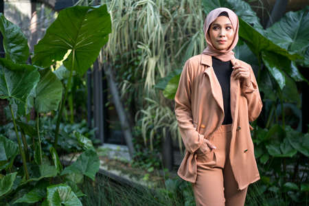 Cyberjaya, Malaysia â 25 December 2019: Fashion portraiture of young beautiful muslim woman wearing hijab.のeditorial素材
