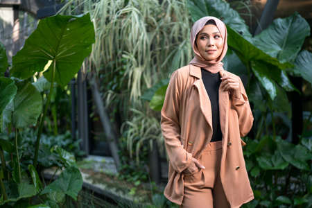 Cyberjaya, Malaysia â 25 December 2019: Fashion portraiture of young beautiful muslim woman wearing hijab.のeditorial素材