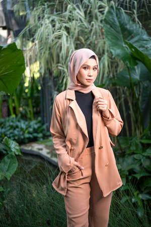 Cyberjaya, Malaysia â 25 December 2019: Fashion portraiture of young beautiful muslim woman wearing hijab.のeditorial素材