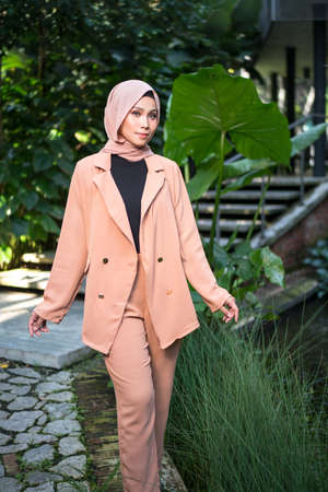 Cyberjaya, Malaysia â 25 December 2019: Fashion portraiture of young beautiful muslim woman wearing hijab.のeditorial素材