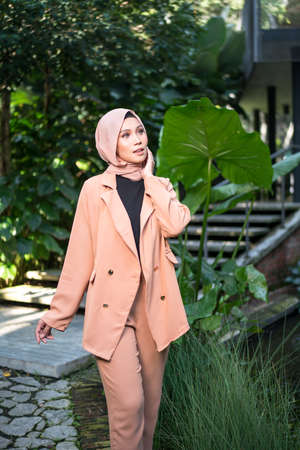 Cyberjaya, Malaysia â 25 December 2019: Fashion portraiture of young beautiful muslim woman wearing hijab.のeditorial素材