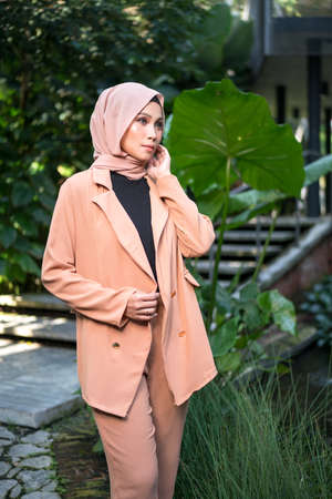 Cyberjaya, Malaysia â 25 December 2019: Fashion portraiture of young beautiful muslim woman wearing hijab.のeditorial素材