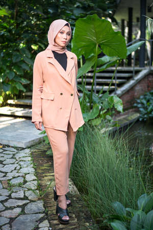 Cyberjaya, Malaysia â 25 December 2019: Fashion portraiture of young beautiful muslim woman wearing hijab.のeditorial素材