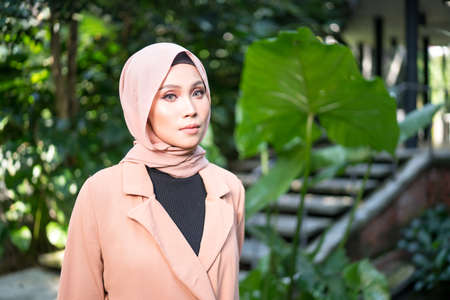 Cyberjaya, Malaysia â 25 December 2019: Fashion portraiture of young beautiful muslim woman wearing hijab.のeditorial素材
