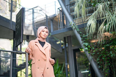 Cyberjaya, Malaysia â 25 December 2019: Fashion portraiture of young beautiful muslim woman wearing hijab.のeditorial素材