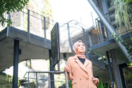 Cyberjaya, Malaysia â 25 December 2019: Fashion portraiture of young beautiful muslim woman wearing hijab.のeditorial素材
