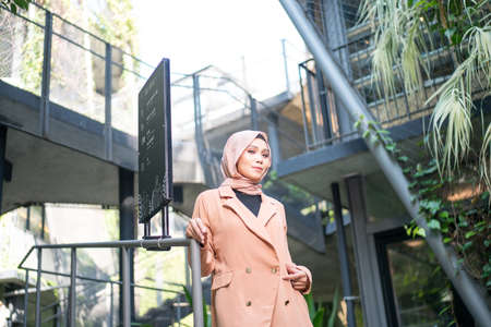 Cyberjaya, Malaysia â 25 December 2019: Fashion portraiture of young beautiful muslim woman wearing hijab.のeditorial素材