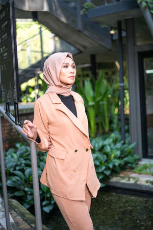 Cyberjaya, Malaysia â 25 December 2019: Fashion portraiture of young beautiful muslim woman wearing hijab.のeditorial素材