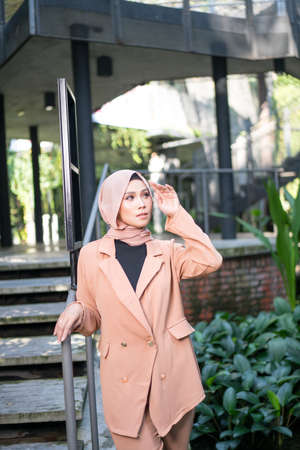 Cyberjaya, Malaysia â 25 December 2019: Fashion portraiture of young beautiful muslim woman wearing hijab.のeditorial素材