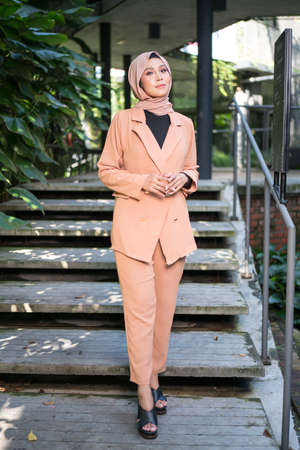 Cyberjaya, Malaysia â 25 December 2019: Fashion portraiture of young beautiful muslim woman wearing hijab.のeditorial素材