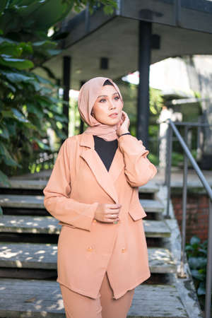 Cyberjaya, Malaysia â 25 December 2019: Fashion portraiture of young beautiful muslim woman wearing hijab.のeditorial素材