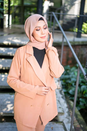 Cyberjaya, Malaysia â 25 December 2019: Fashion portraiture of young beautiful muslim woman wearing hijab.のeditorial素材