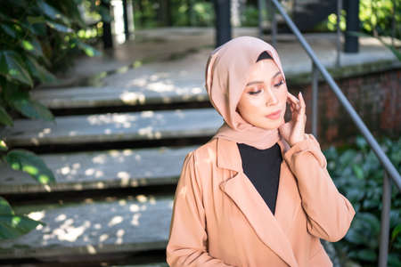 Cyberjaya, Malaysia â 25 December 2019: Fashion portraiture of young beautiful muslim woman wearing hijab.のeditorial素材