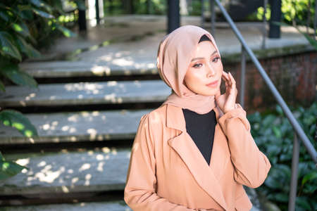 Cyberjaya, Malaysia â 25 December 2019: Fashion portraiture of young beautiful muslim woman wearing hijab.のeditorial素材