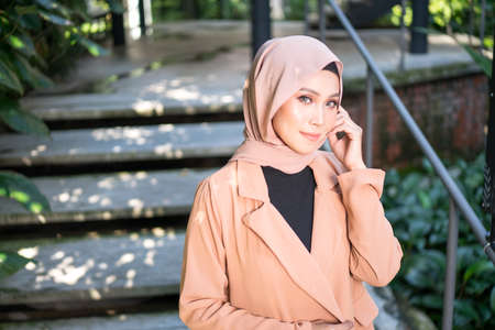 Cyberjaya, Malaysia â 25 December 2019: Fashion portraiture of young beautiful muslim woman wearing hijab.のeditorial素材