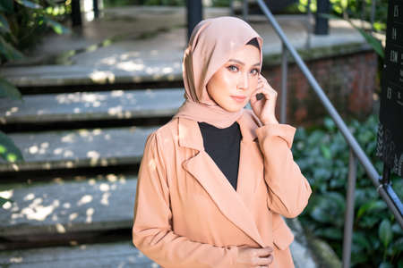 Cyberjaya, Malaysia â 25 December 2019: Fashion portraiture of young beautiful muslim woman wearing hijab.のeditorial素材