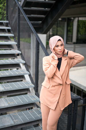 Cyberjaya, Malaysia â 25 December 2019: Fashion portraiture of young beautiful muslim woman wearing hijab.のeditorial素材