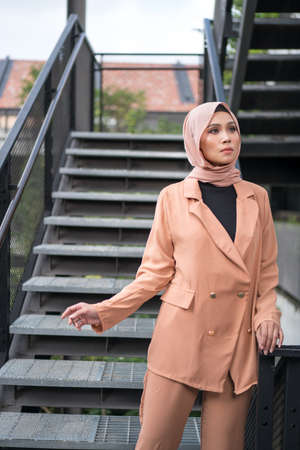 Cyberjaya, Malaysia â 25 December 2019: Fashion portraiture of young beautiful muslim woman wearing hijab.のeditorial素材