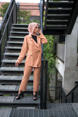 Cyberjaya, Malaysia â 25 December 2019: Fashion portraiture of young beautiful muslim woman wearing hijab.のeditorial素材