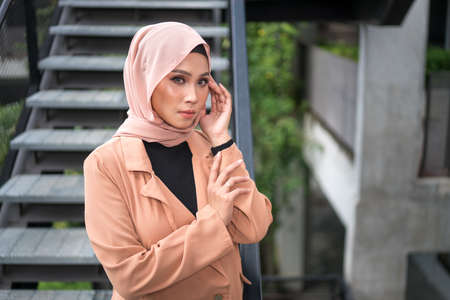 Cyberjaya, Malaysia â 25 December 2019: Fashion portraiture of young beautiful muslim woman wearing hijab.のeditorial素材