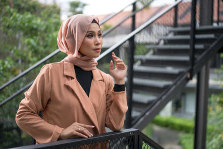 Cyberjaya, Malaysia â 25 December 2019: Fashion portraiture of young beautiful muslim woman wearing hijab.のeditorial素材