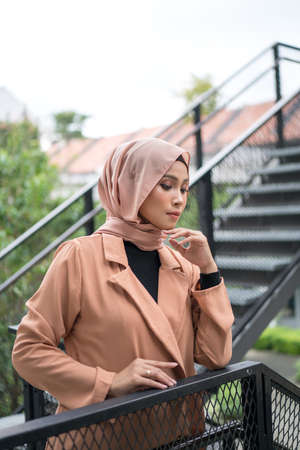 Cyberjaya, Malaysia â 25 December 2019: Fashion portraiture of young beautiful muslim woman wearing hijab.のeditorial素材
