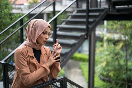 Cyberjaya, Malaysia â 25 December 2019: Fashion portraiture of young beautiful muslim woman wearing hijab.のeditorial素材