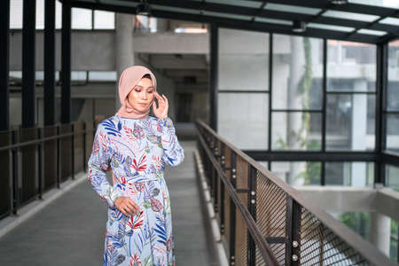 Cyberjaya, Malaysia â 25 December 2019: Fashion portraiture of young beautiful muslim woman wearing hijab.のeditorial素材
