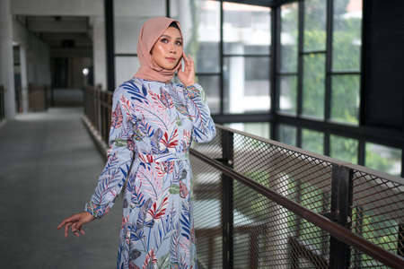 Cyberjaya, Malaysia â 25 December 2019: Fashion portraiture of young beautiful muslim woman wearing hijab.のeditorial素材