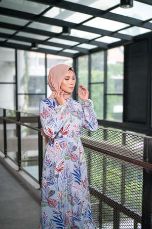Cyberjaya, Malaysia â 25 December 2019: Fashion portraiture of young beautiful muslim woman wearing hijab.のeditorial素材