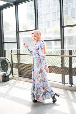 Cyberjaya, Malaysia â 25 December 2019: Fashion portraiture of young beautiful muslim woman wearing hijab.のeditorial素材