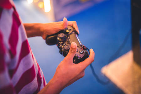 Closeup Boy's Hands With Joystick Controlling Gameのeditorial素材
