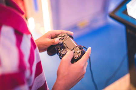Closeup Boy's Hands With Joystick Controlling Gameのeditorial素材