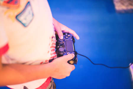 Closeup Boy's Hands With Joystick Controlling Gameのeditorial素材