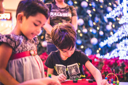 Kuala Lumpur, Malaysia â December, 2019: Children play with Lego blocks at Pavilion Shopping Mall in Bukit Bintang.のeditorial素材