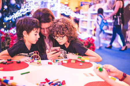 Kuala Lumpur, Malaysia â December, 2019: Children play with Lego blocks at Pavilion Shopping Mall in Bukit Bintang.のeditorial素材