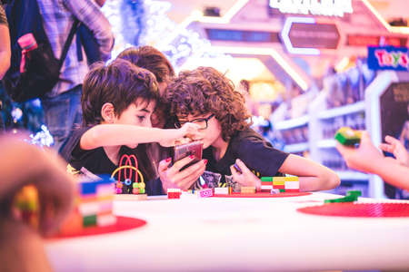 Kuala Lumpur, Malaysia â December, 2019: Children play with Lego blocks at Pavilion Shopping Mall in Bukit Bintang.のeditorial素材